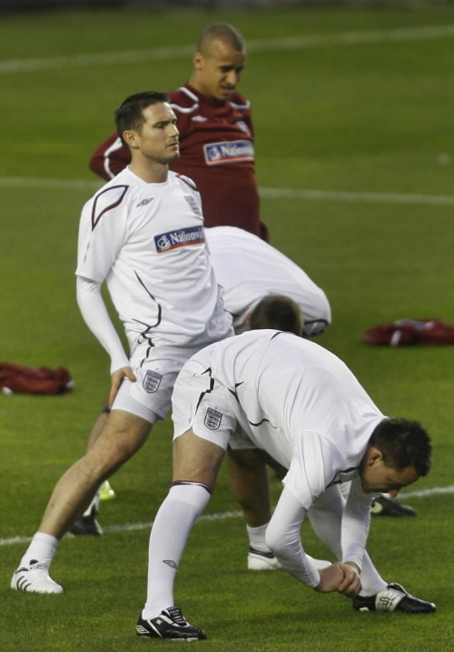 England stars Frank Lampard, left, and John Terry get in a little "training" prior to the Brits' friendly against Spain in Seville.